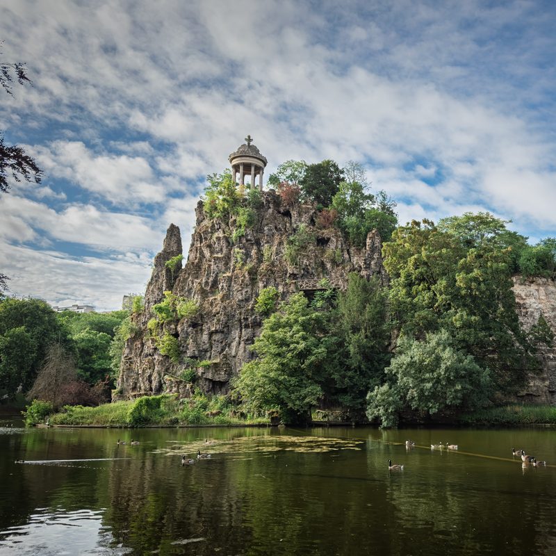 The Temple de la Sibylle on its rocky cliff above the lake in the Parc des Buttes-Chaumont, Paris
